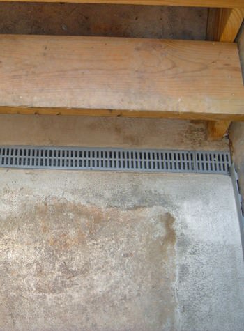 grated basement drain system for the end of stair cases that leak